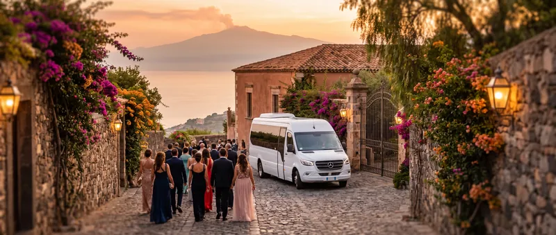 Wedding guests in evening dress walking toward a white minibus at the gate of a villa above the sea near Taormina, with Mount Etna in the distance